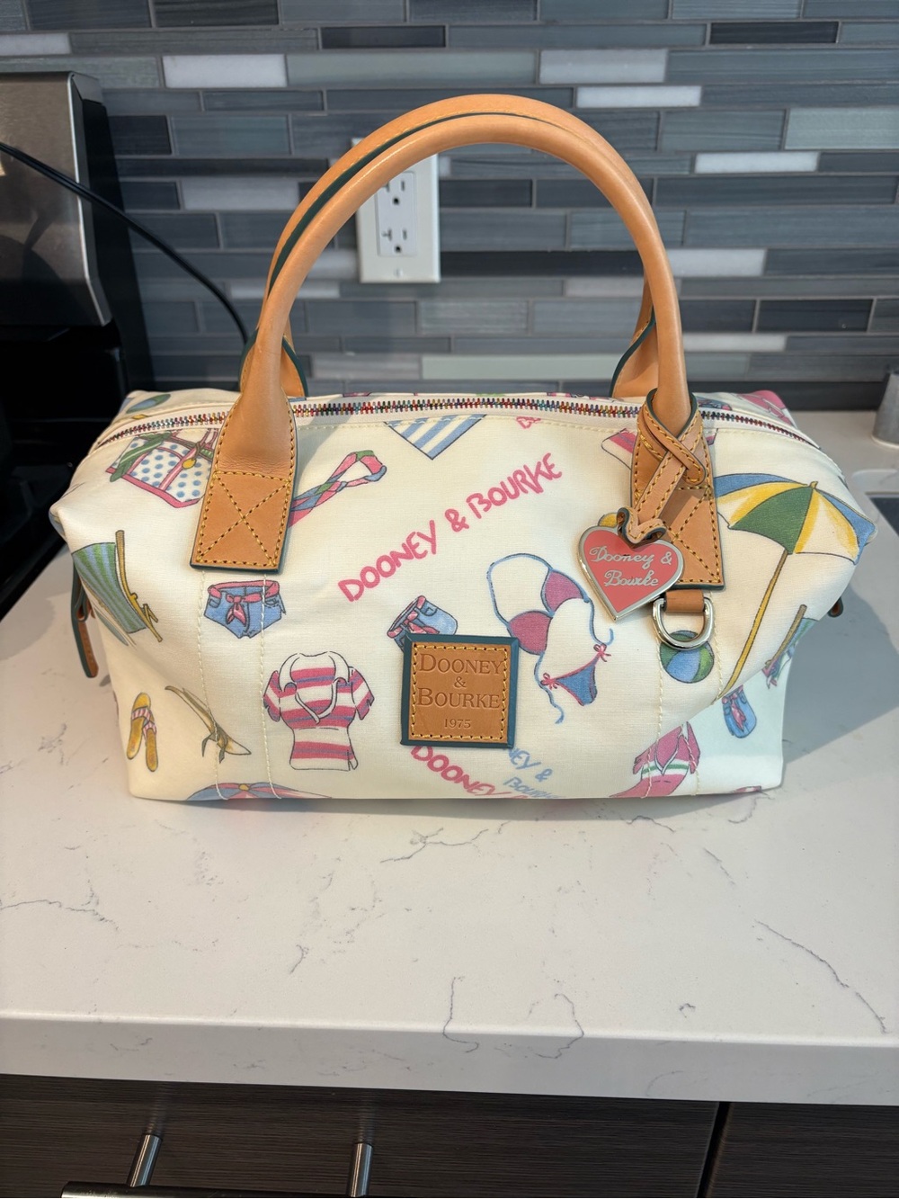 Dooney & Bourke Cream Beach Print Duffle Bag with Tan Handles